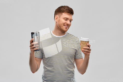 Image of man comparing thermo cup or tumbler and coffee cup