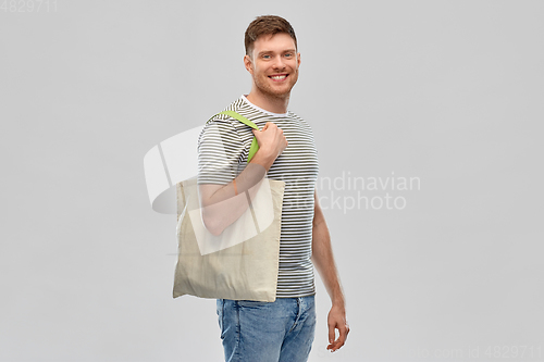 Image of man with reusable canvas bag for food shopping