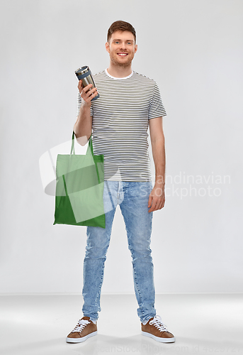 Image of man with bag for food shopping and tumbler