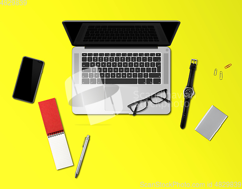 Image of Office desk mockup top view isolated on yellow