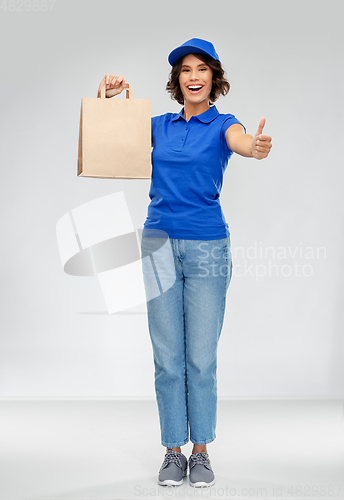 Image of delivery woman with paper bag showing thumbs up
