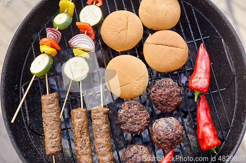 Image of barbecue kebab meat and vegetables on grill