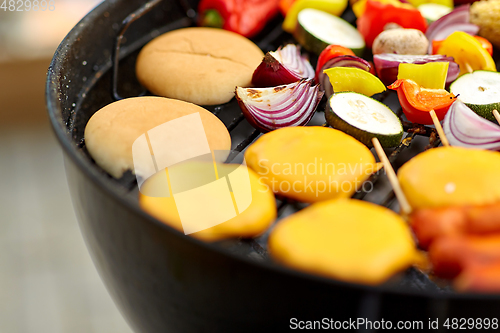 Image of barbecue kebab meat and vegetables on grill