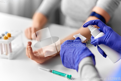 Image of doctor and patient preparing for blood test