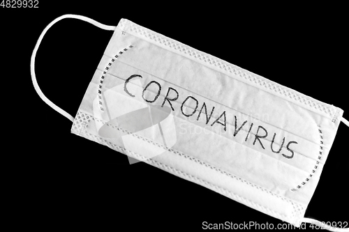 Image of face protective medical mask with coronavirus