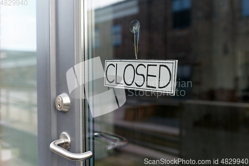 Image of glass door of closed shop or office