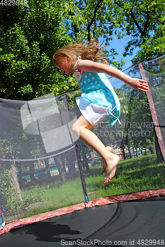 Image of girl jumps on the trampoline