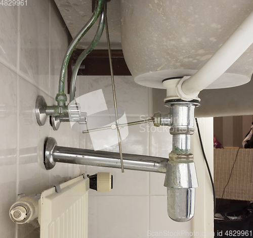 Image of Basin siphon or sink drain in a bathroom