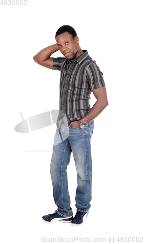 Image of Disappointed looking African man standing