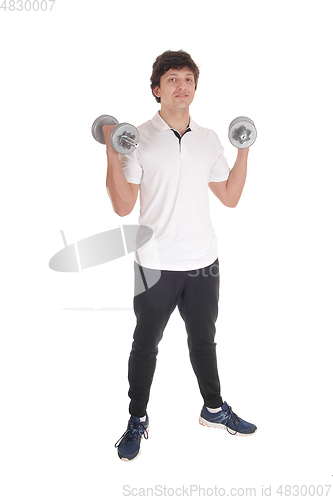 Image of Young man exercise wit two dumbbell