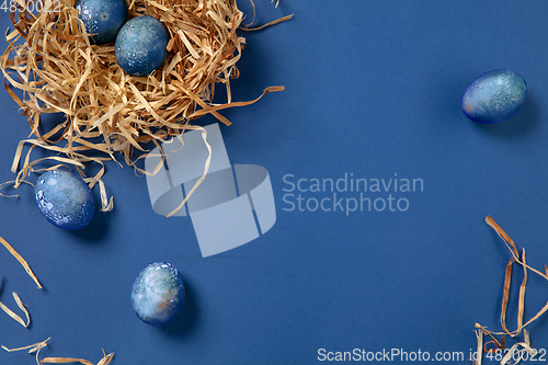 Image of Egg hunt is coming. Easter traditions, space, cosmos colored eggs, top view