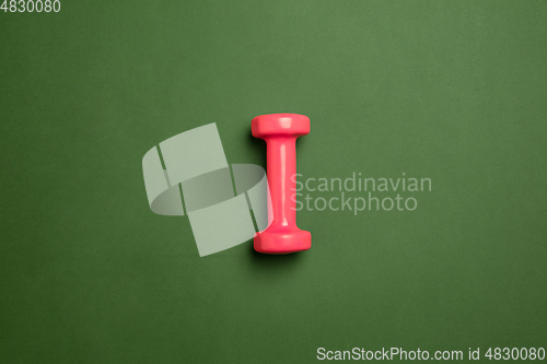 Image of Sport equipment isolated on green studio background