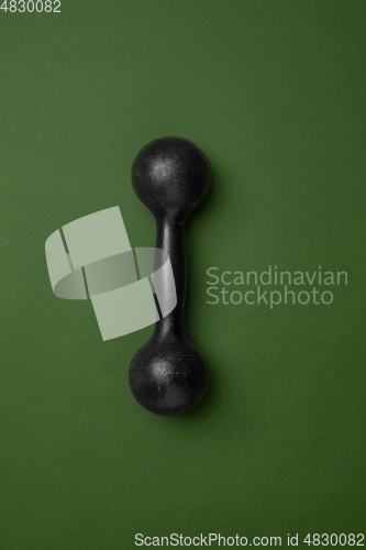 Image of Sport equipment isolated on green studio background