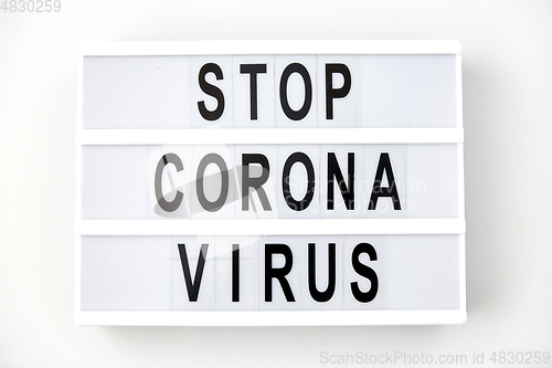 Image of lightbox with stop coronavirus caution words