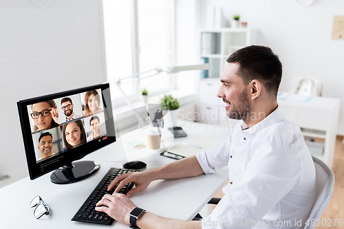 Image of businessman has video call with partners at office