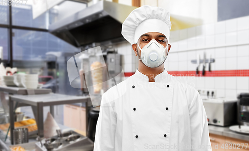 Image of male chef with in respirator at kebab shop kitchen