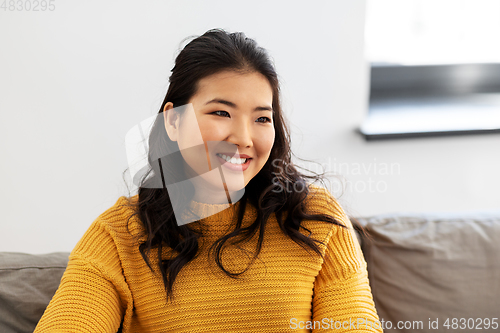 Image of portrait of happy smiling asian young woman