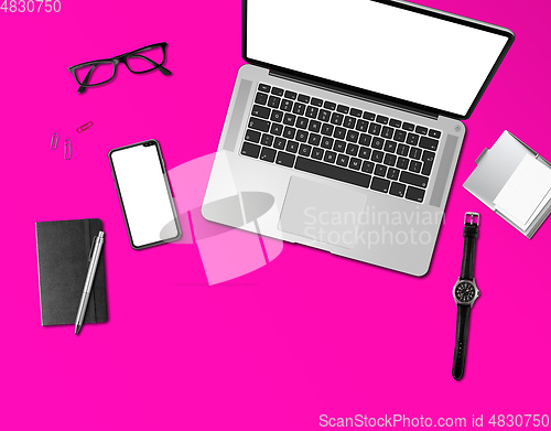 Image of Office desk mockup top view isolated on magenta pink