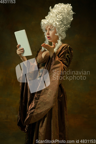 Image of Medieval young woman in old-fashioned costume