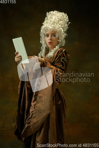 Image of Medieval young woman in old-fashioned costume