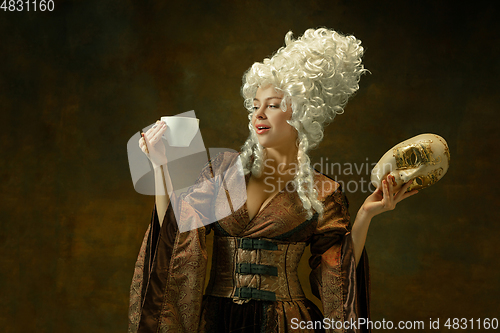Image of Medieval young woman in old-fashioned costume