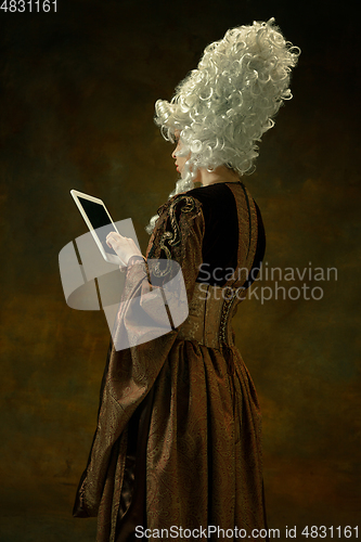 Image of Medieval young woman in old-fashioned costume