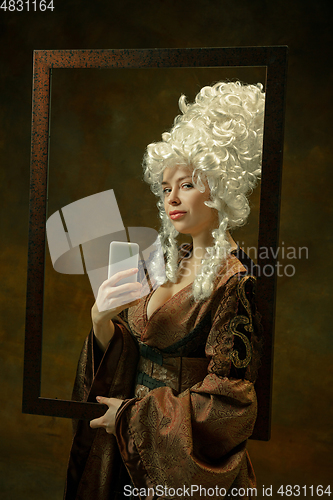 Image of Medieval young woman in old-fashioned costume