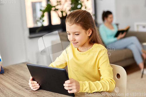 Image of student girl with tablet pc and mother at home