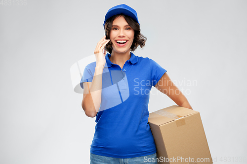 Image of delivery girl with parcel box calls on smartphone