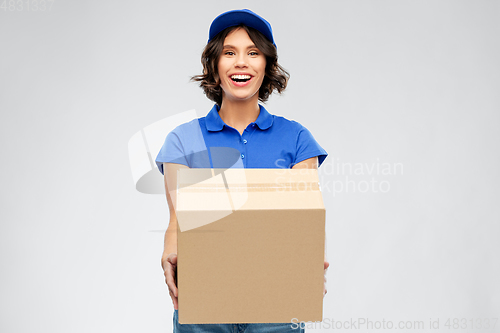 Image of happy delivery girl with parcel box in blue