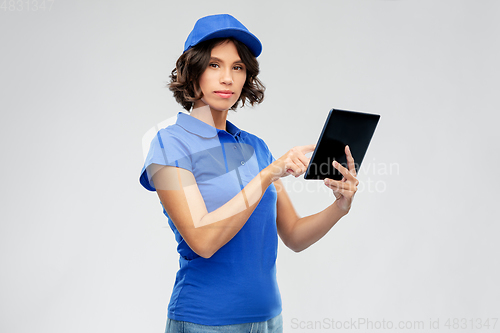 Image of delivery girl in blue uniform with tablet computer