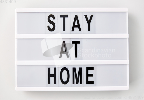 Image of lightbox with stay at home caution words
