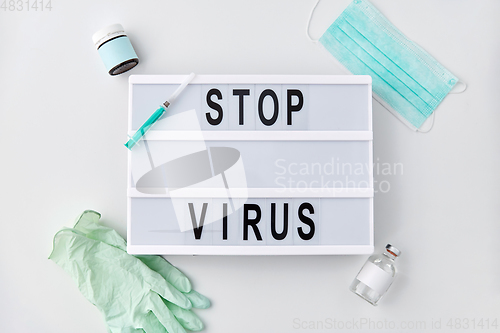 Image of lightbox with stop virus caution words