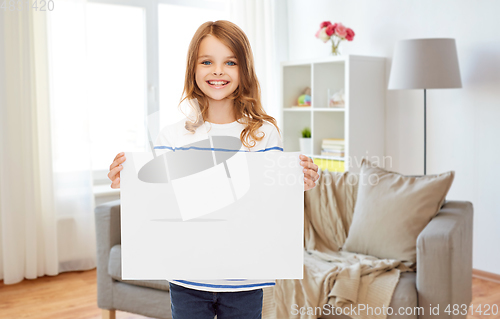 Image of happy girl holding white blank paper sheet at home