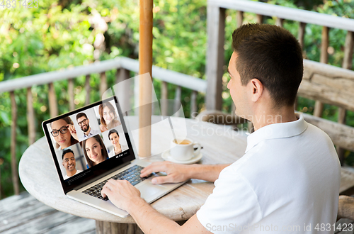 Image of man with laptop having video call with colleagues