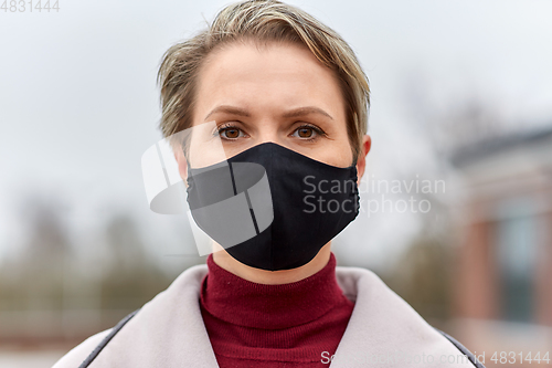 Image of woman wearing protective reusable barrier mask