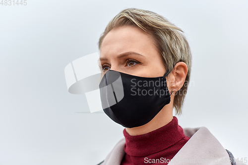 Image of woman wearing protective reusable barrier mask