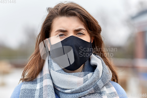 Image of woman wearing protective reusable barrier mask