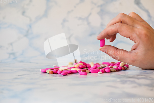 Image of Shot of tablet in the fingers of hand