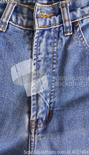 Image of Fragment of classic blue fashioned jeans