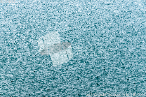 Image of Abstract background, rain drops on the water