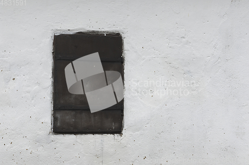 Image of window on old house wall