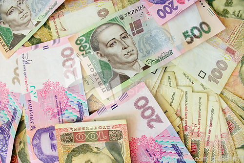 Image of different Ukrainian money in cash