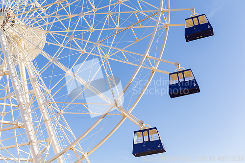 Image of Ferris wheel under blue sky