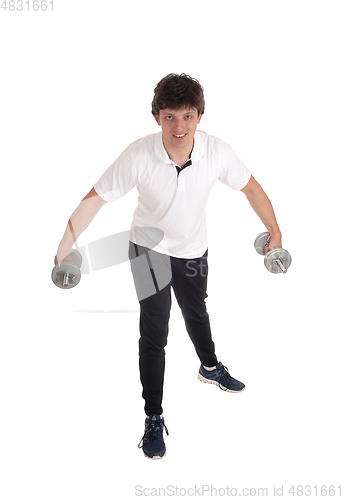 Image of Exercising young man with two dumbbells
