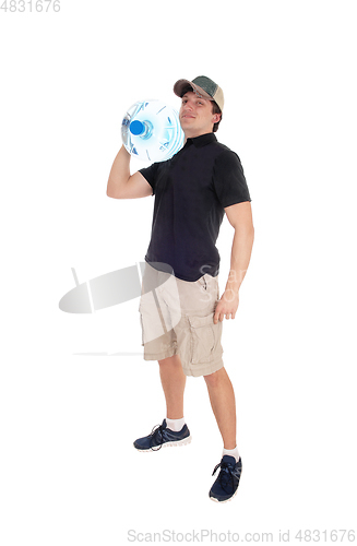 Image of Full body image of man carrying big water bottle