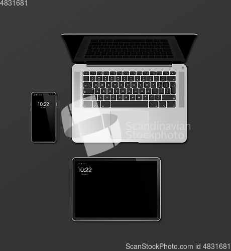 Image of Laptop, tablet and phone set mockup isolated on black. 3D render