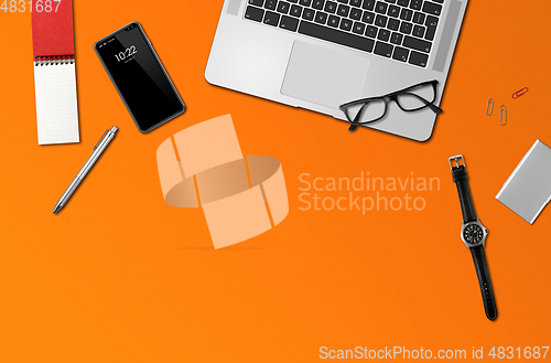 Image of Office desk mockup top view isolated on orange