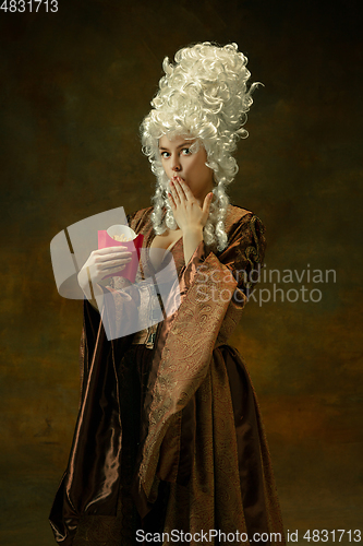 Image of Medieval young woman in old-fashioned costume