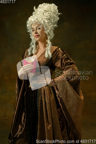 Image of Medieval young woman in old-fashioned costume